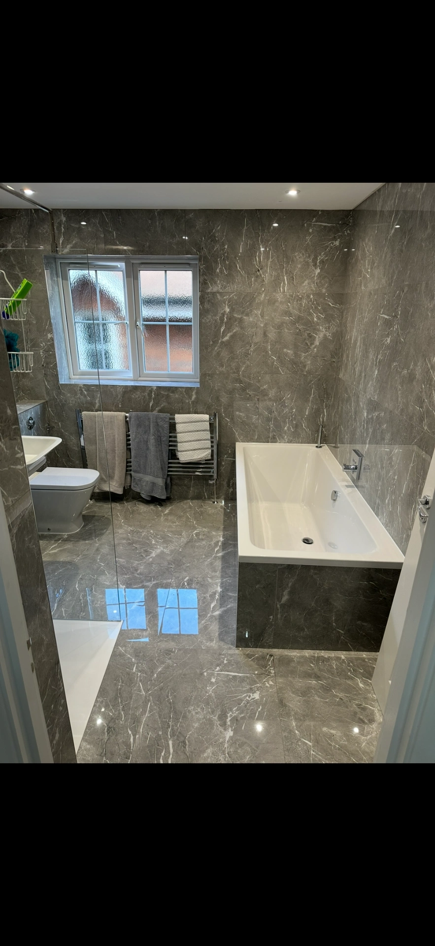 Grey marble family bathroom with bath, walk-in shower and heated towel rail — Sunningdale, Berkshire